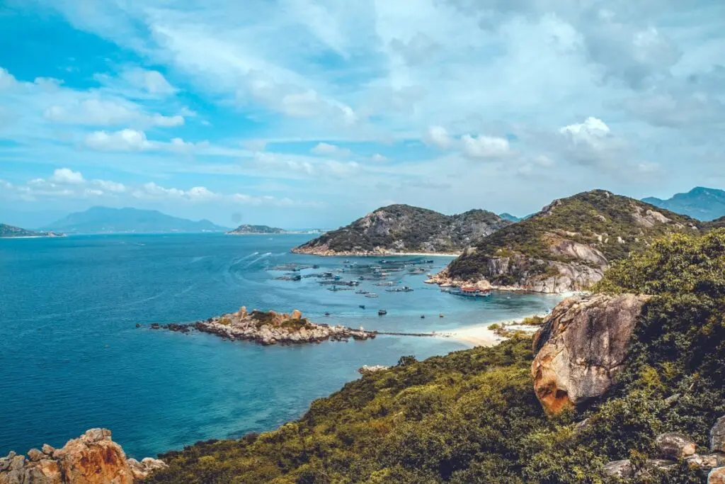 Elevated view over the picturesque Cam Ranh Bay with rocky hills and blue waters.
