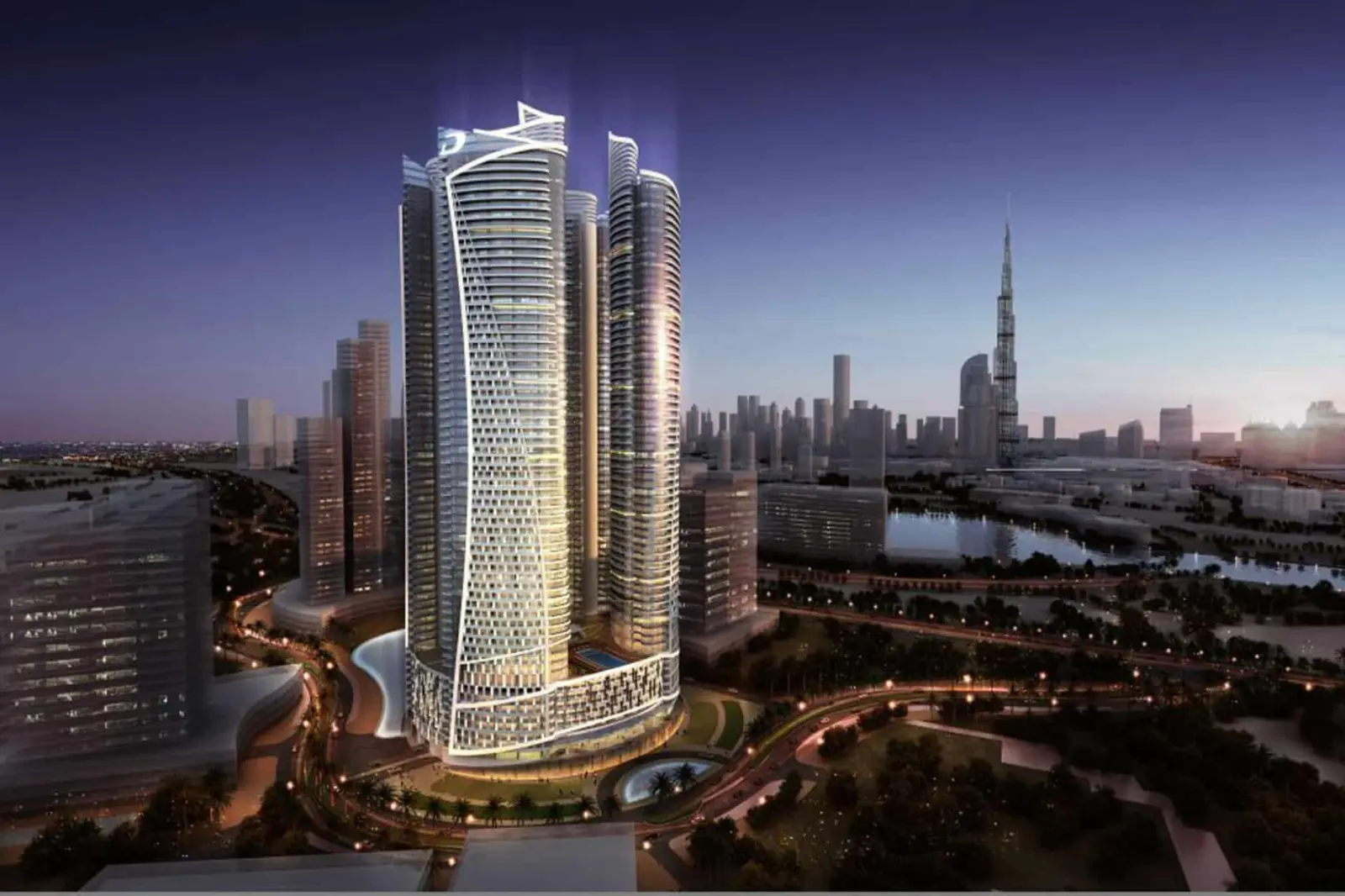 Night view of the hotel tower complex against the illuminated Dubai skyline.